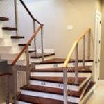 indoor stairs with protective metal cable railing